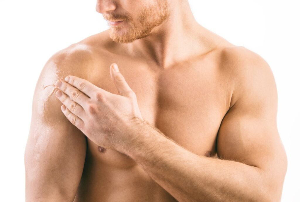 Man applying testosterone replacement therapy cream